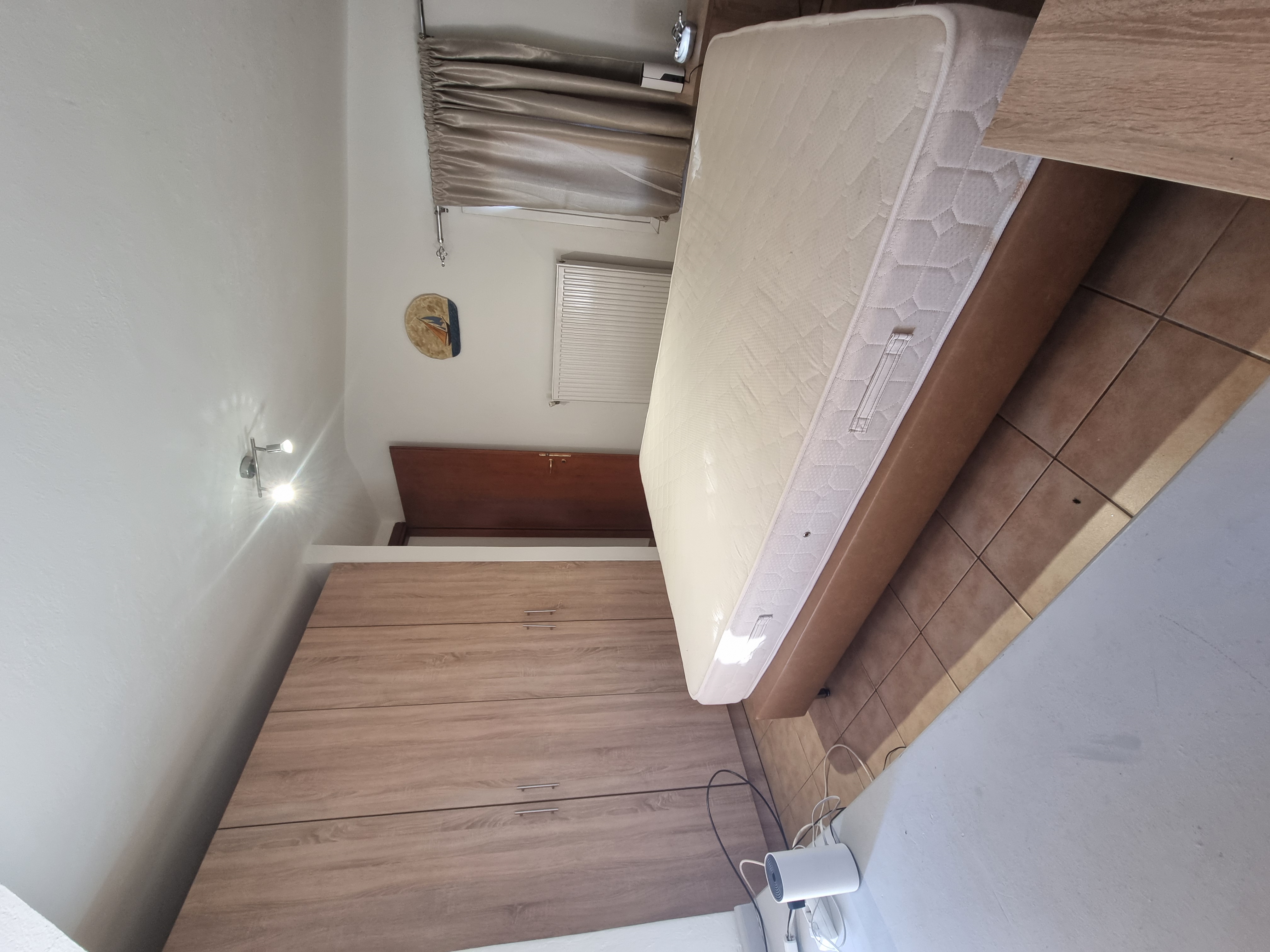 Polychrono Seabreeze Balcony Apartment double bedroom with wardrobe storage