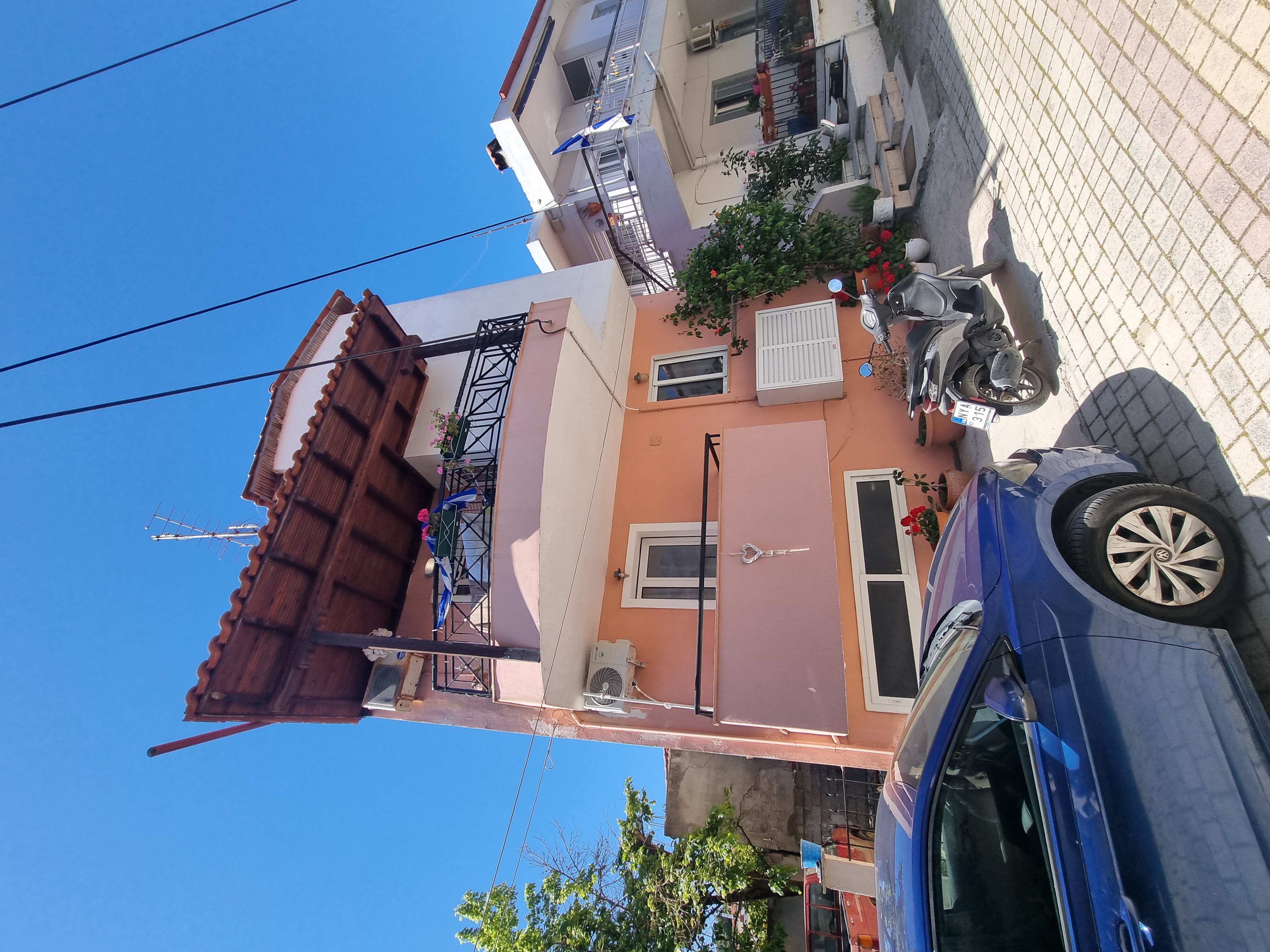 Polychrono Seabreeze Balcony Apartment building exterior with nearby parking area