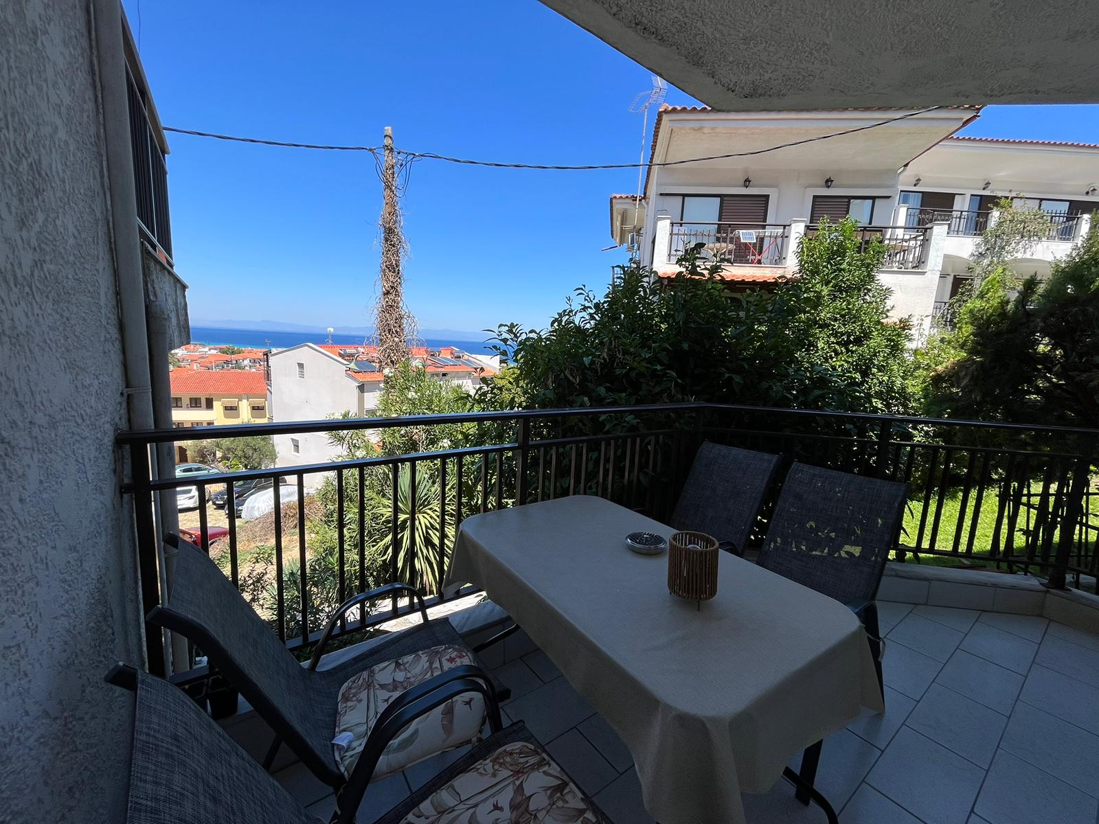 Aegean Dream balcony with outdoor dining and sea view