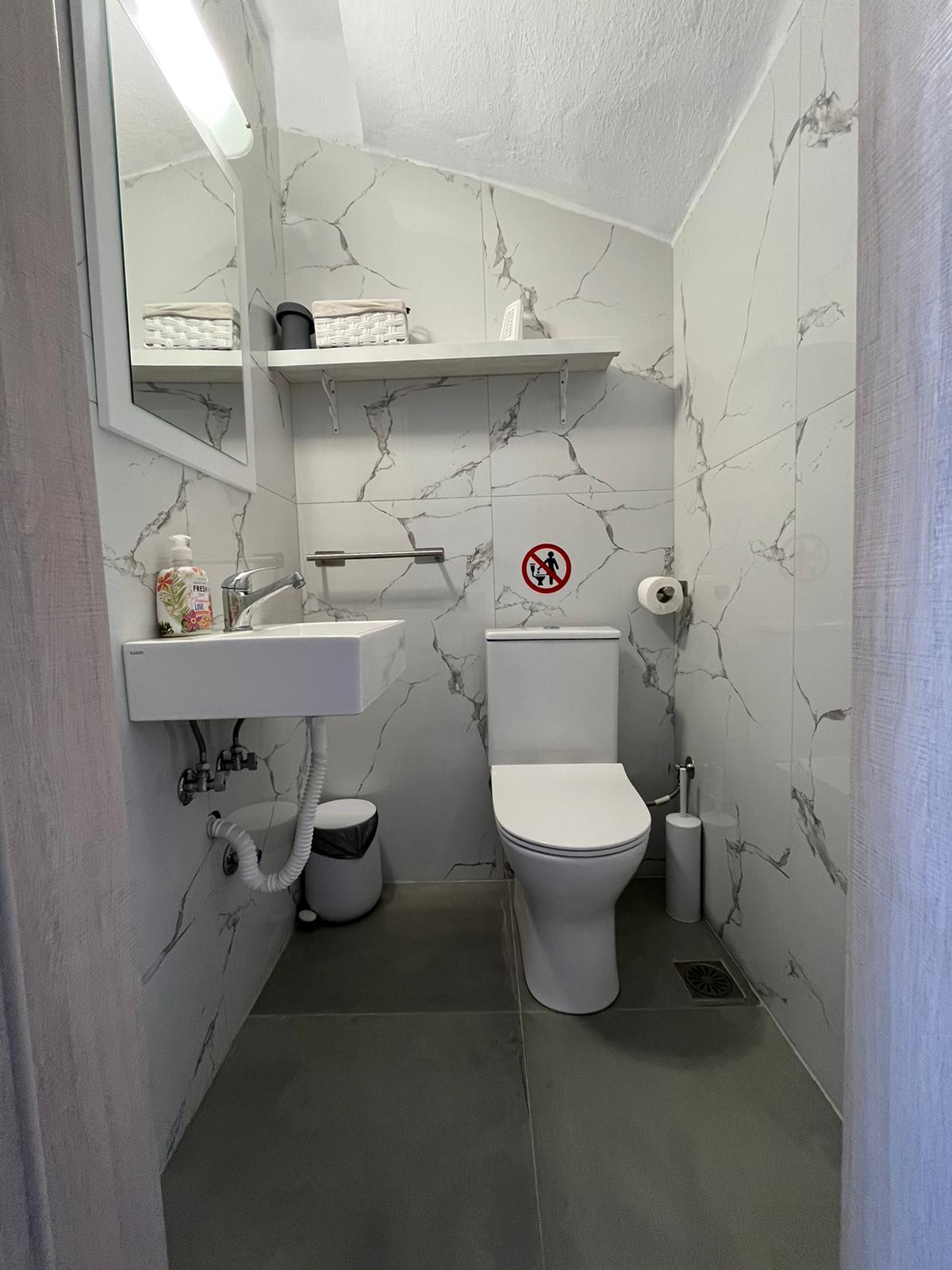 Aegean Dream bathroom with toilet and vanity