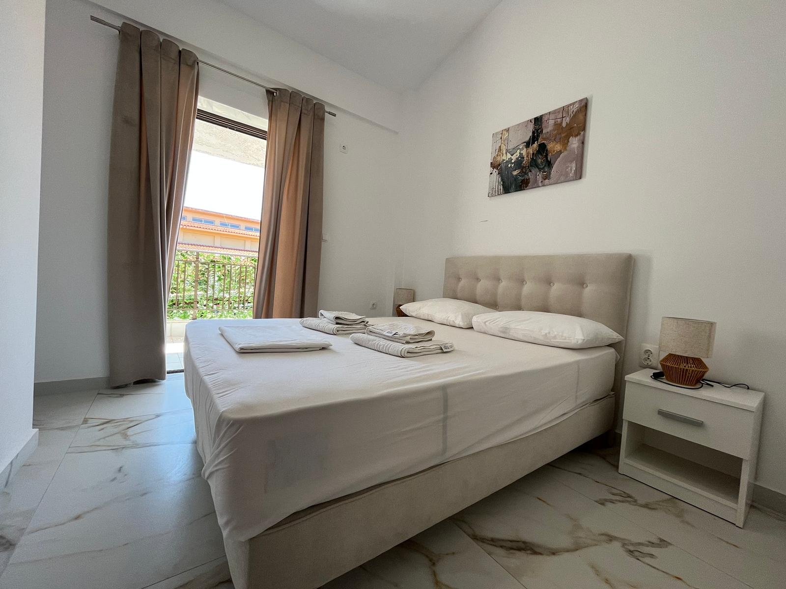 Aegean Dream bedroom with double bed and balcony doors