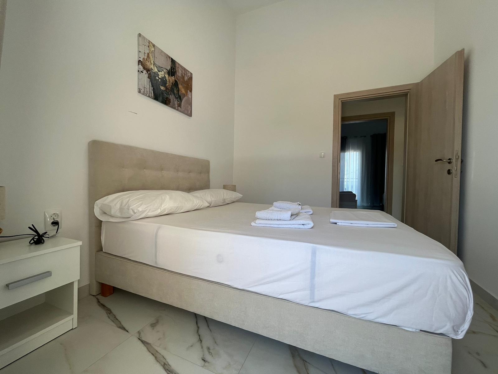 Aegean Dream bedroom with double bed and towels