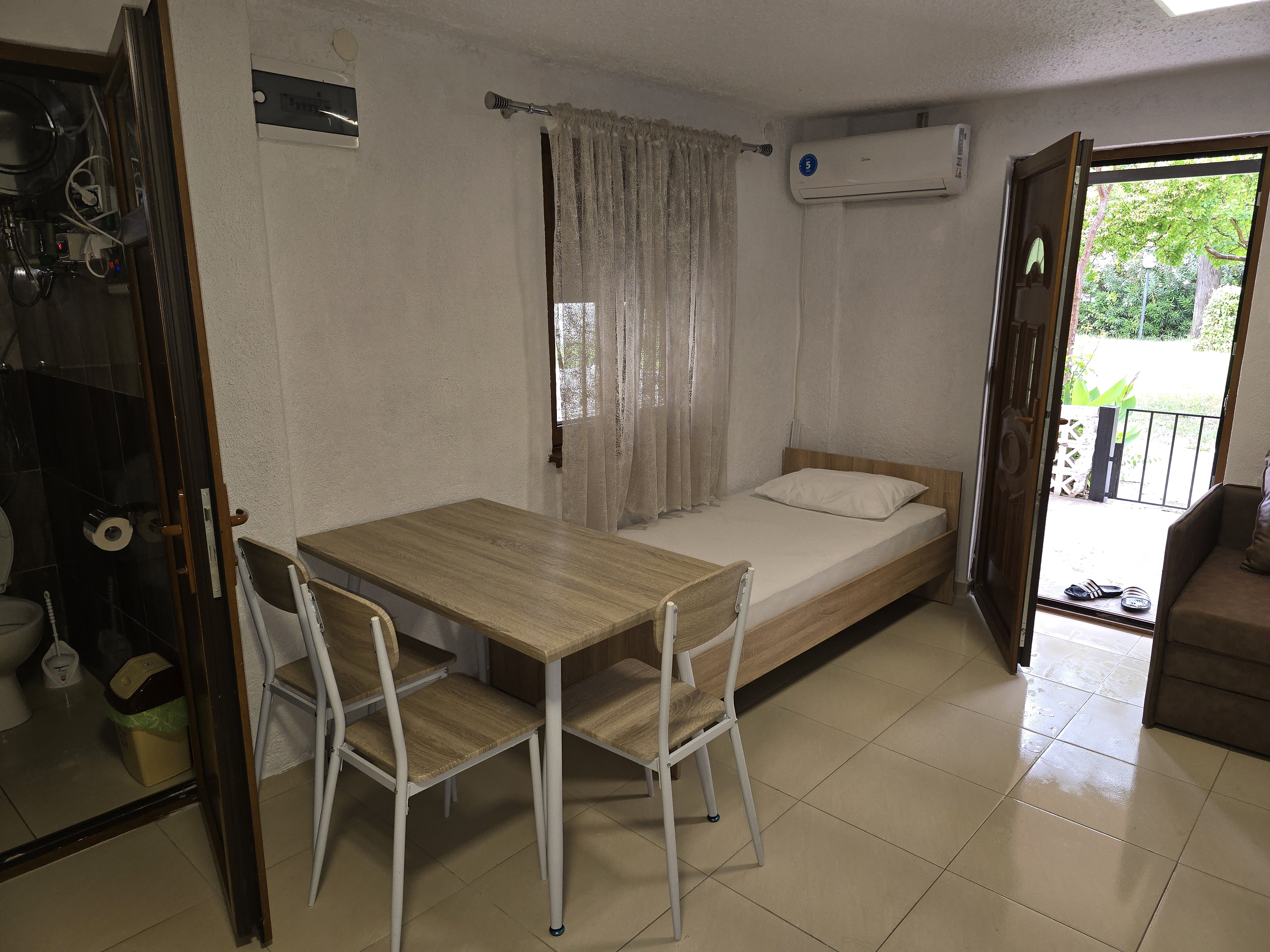 Apartment with Garden View photo 14 at Garden Haven 100m from the Sea in Siviri