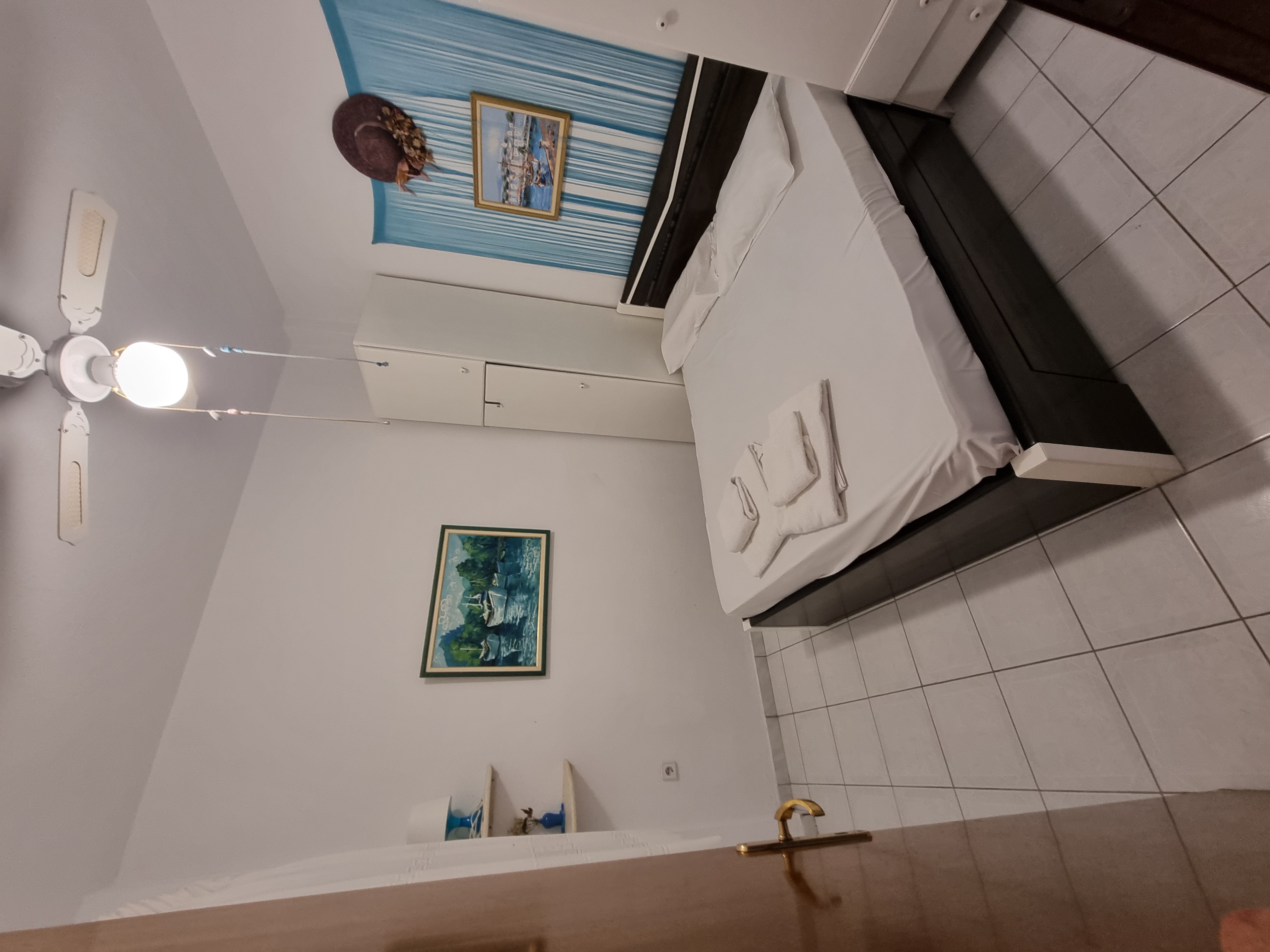 Polychrono Duplex bedroom with double bed and wardrobe