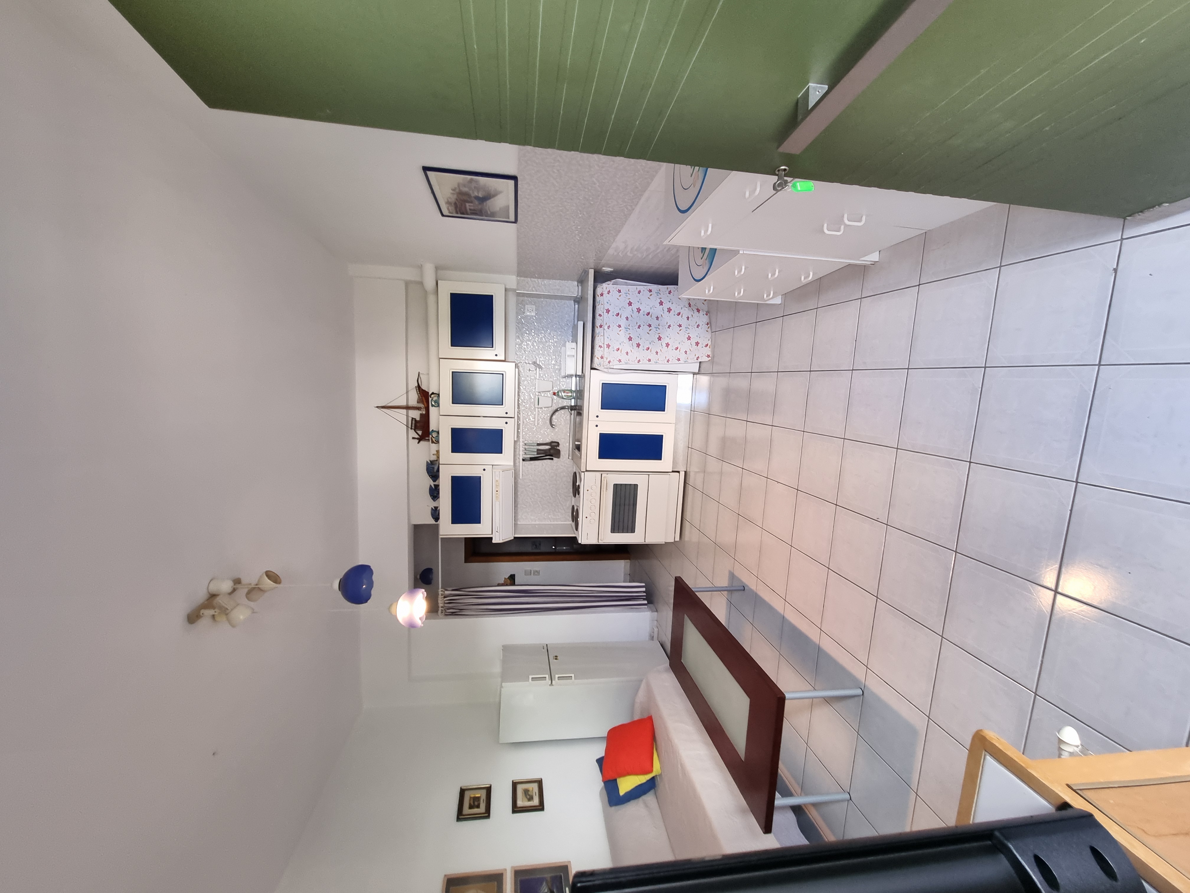 Polychrono Duplex open living room and private kitchen