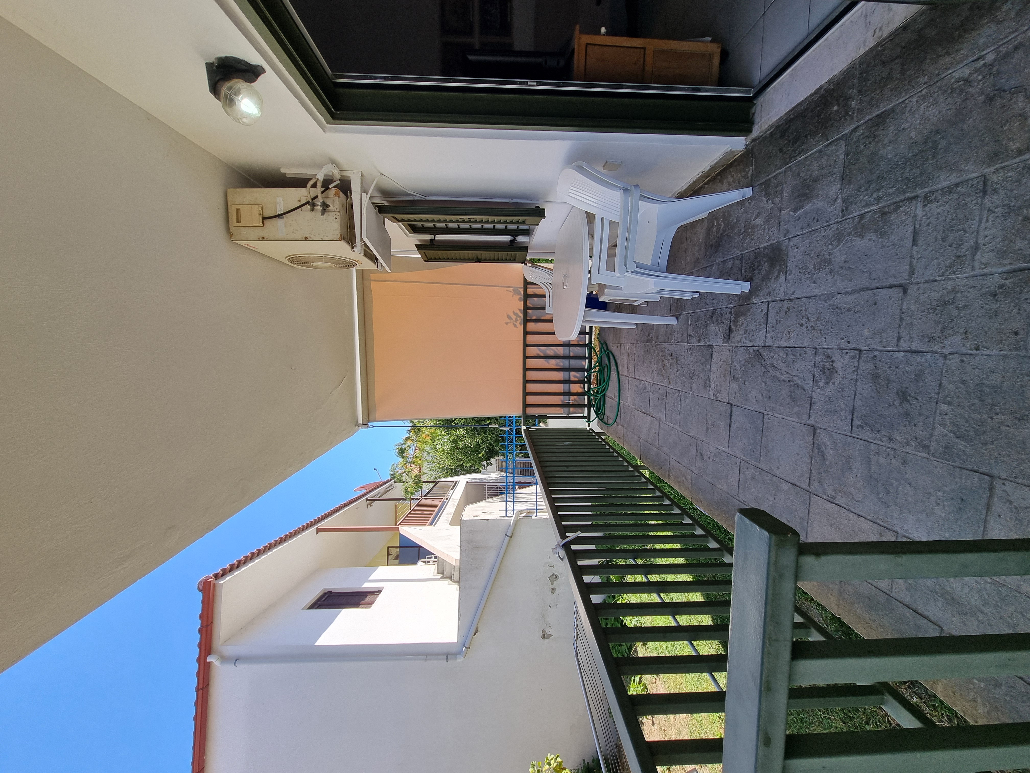 Polychrono Duplex terrace with outdoor table and chairs